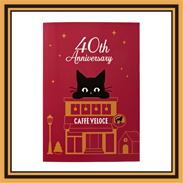 40周年の黒ねこと店舗を描いた赤いミニノート